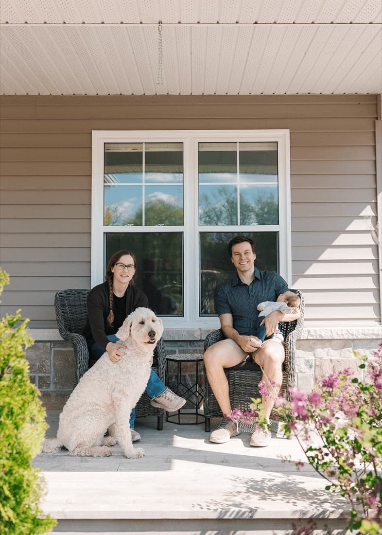 Matthew Maynes with his family outdoors.